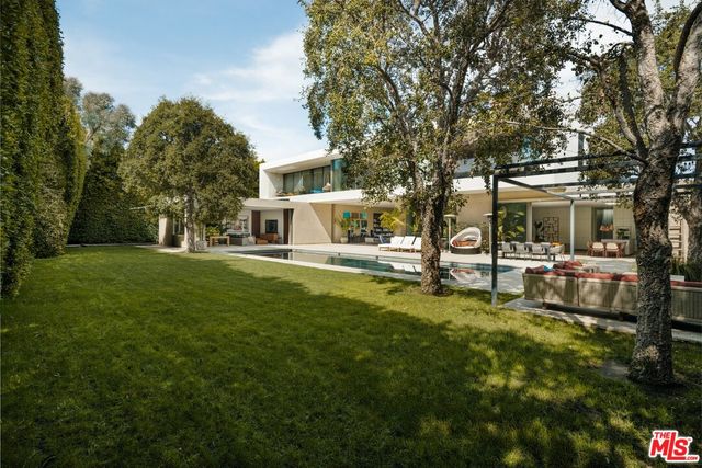 a view of house with outdoor space and garden