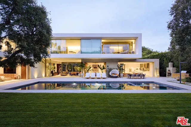 a view of a swimming pool with furniture