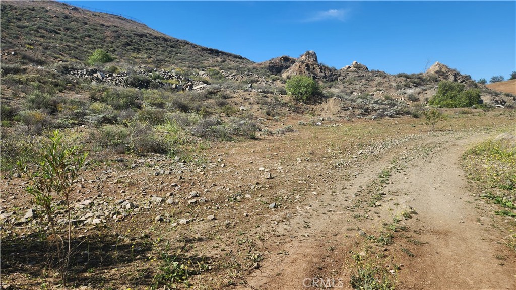 0 Norco Norco, CA 92860 - Photo 10 of 16 a view of a dry yard with mountains in the background