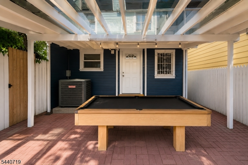 136 Smith Street Elizabeth, NJ 07201 - Photo 36 of 38 a room with table table tennis table
