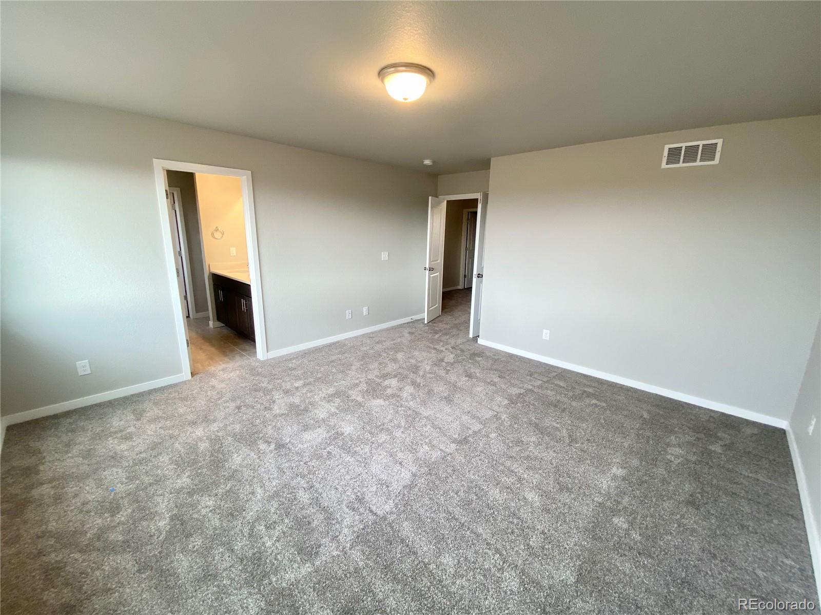 517 Ryan Avenue Fort Lupton, CO 80621 - Photo 17 of 21 an empty room with a view of wooden floor