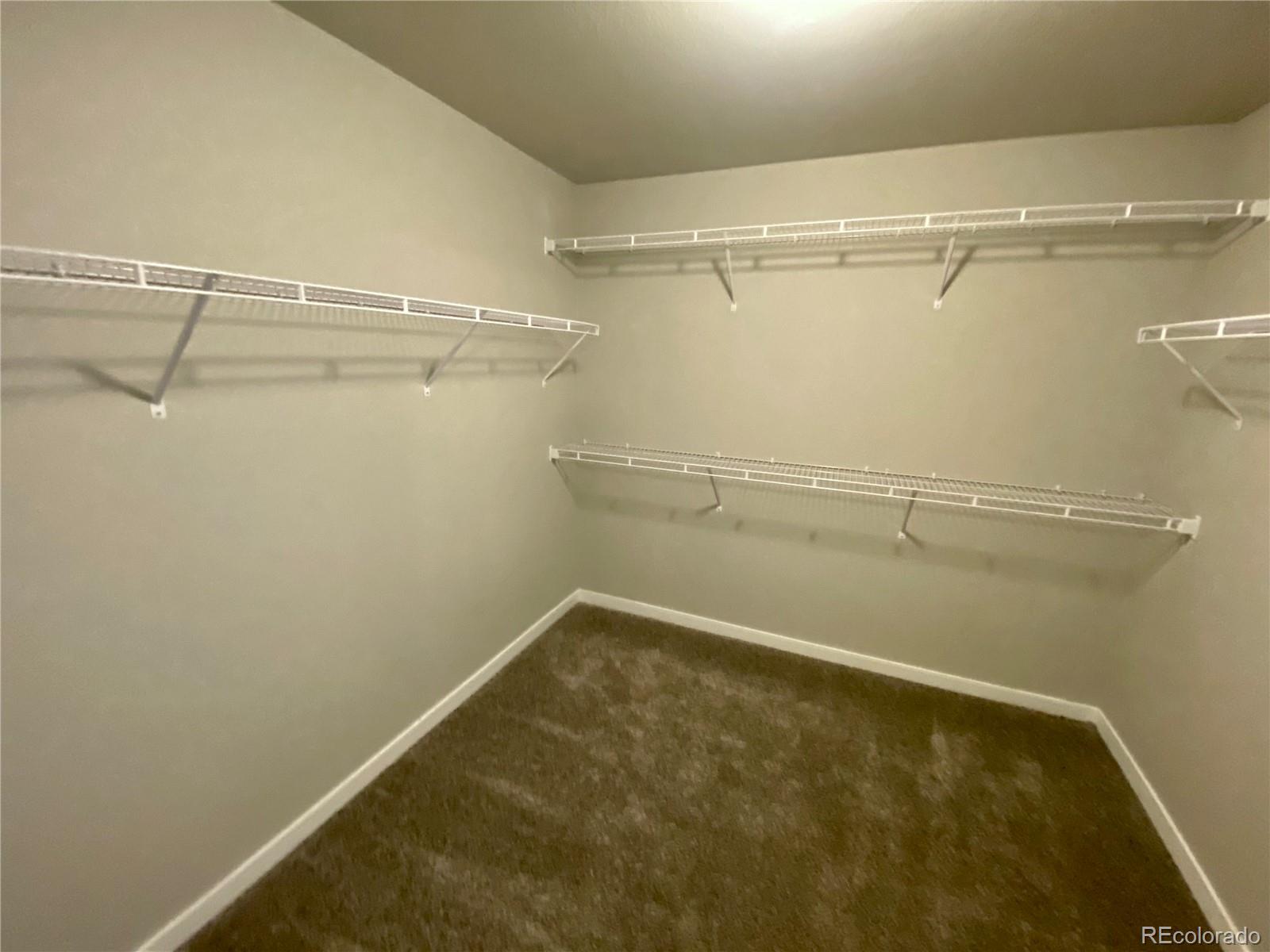 517 Ryan Avenue Fort Lupton, CO 80621 - Photo 20 of 21 a view of a room with racks on the wall