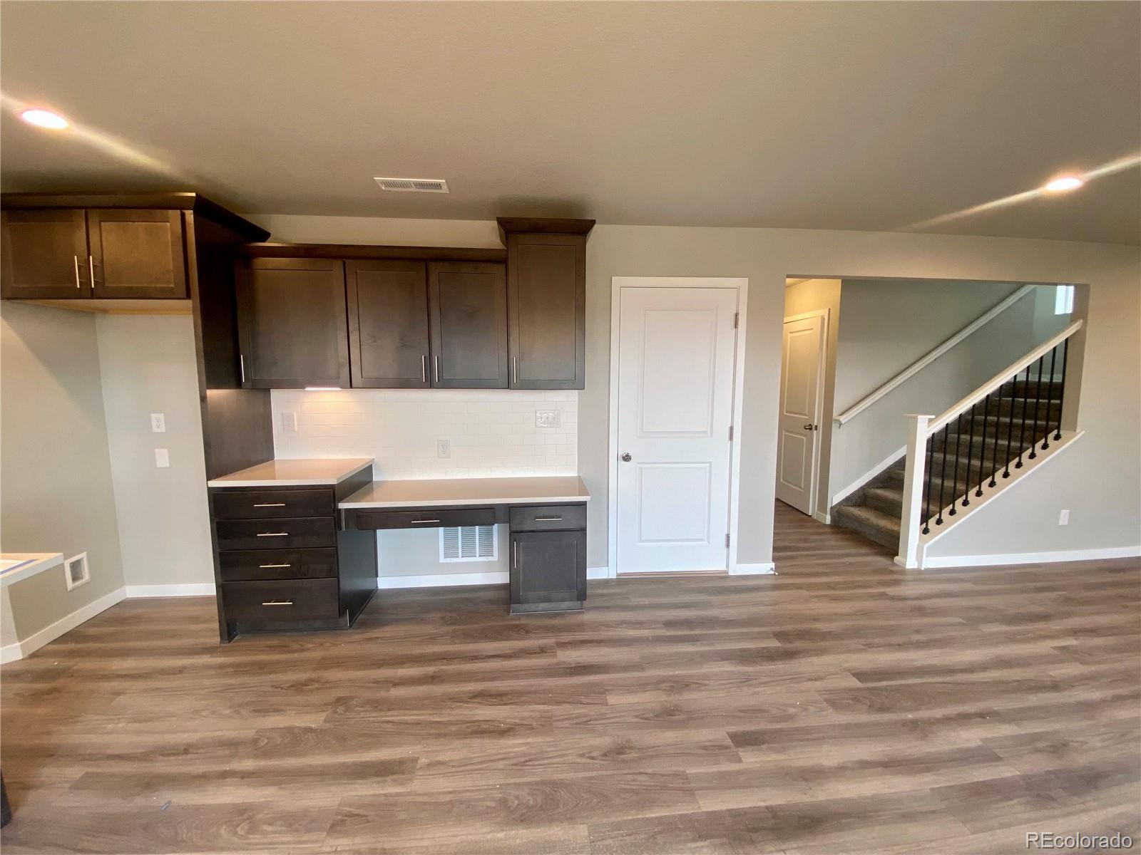 517 Ryan Avenue Fort Lupton, CO 80621 - Photo 5 of 21 a living room with wooden floor and furniture