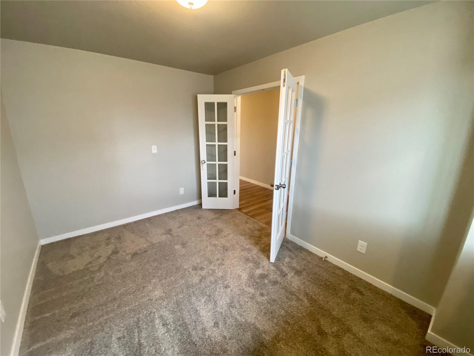 517 Ryan Avenue Fort Lupton, CO 80621 - Photo 6 of 21 an empty room with closet area