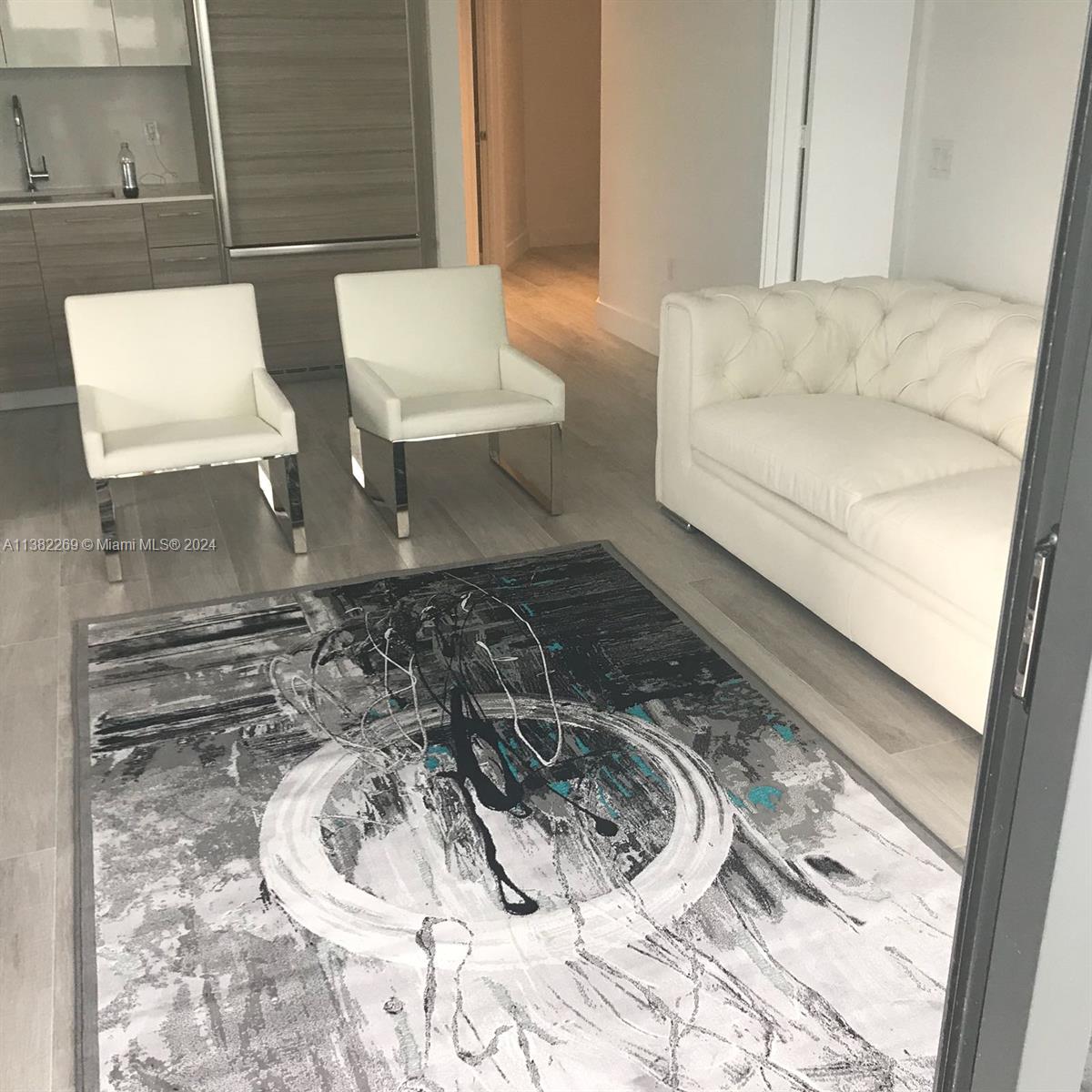 121 Northeast 34th Street, Unit 2601 Miami, FL 33137 - Photo 8 of 10 a bathroom with a bathtub and sink