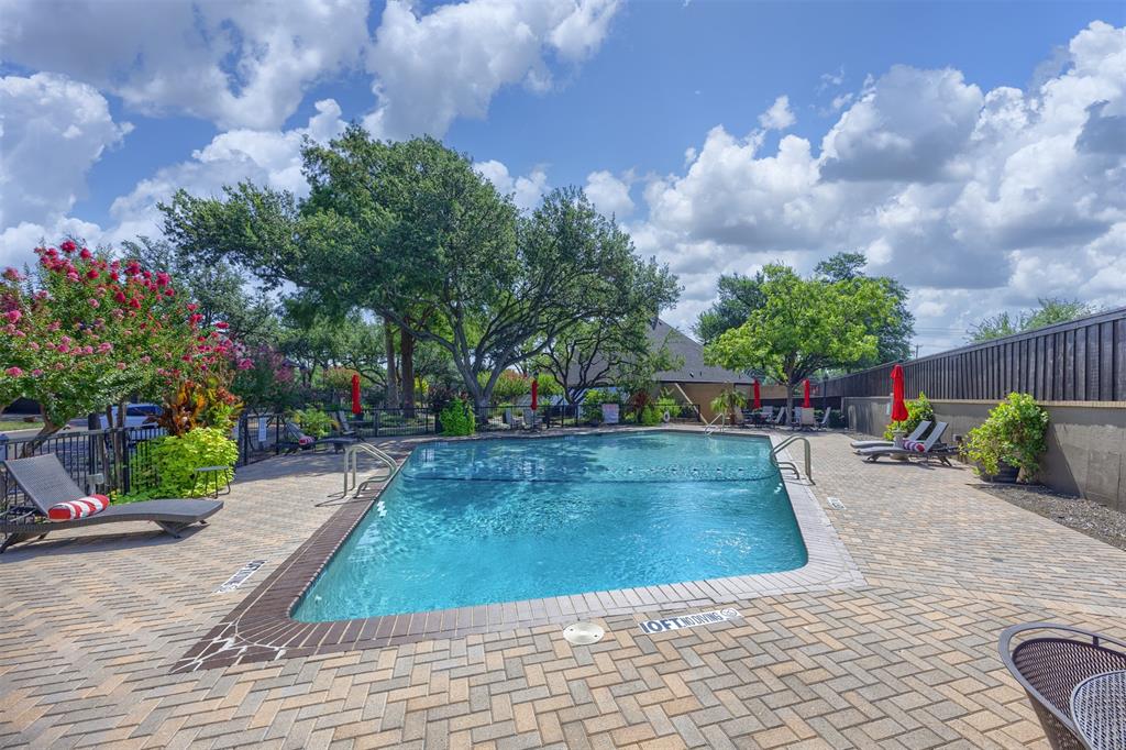 15615 Preston Road, Unit 1010 Dallas, TX 75248 - Photo 6 of 40 Preston 39 Community Swimming Pool, deck, seating areas, fencing and landscaping. Community clubhouse is shown at the rear of the photograph.