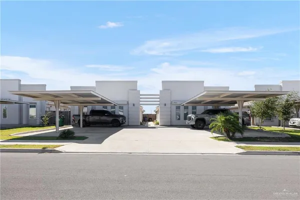 a view of a building with cars park