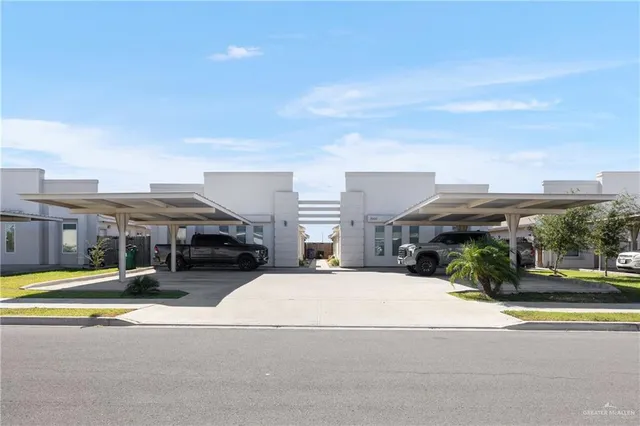 a view of a building with cars park