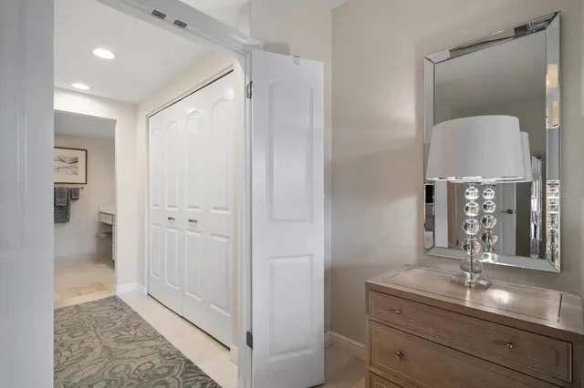 a en suite bathroom with a granite countertop sink and a mirror