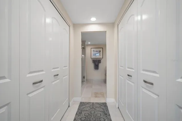 a spacious bathroom with a double vanity sink mirror and shower