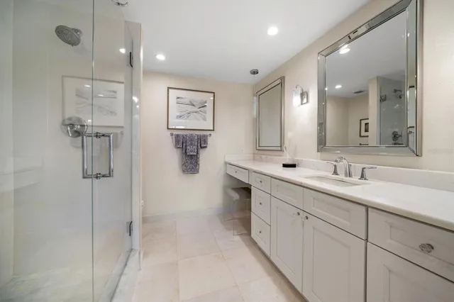 a bathroom with double sink and a mirror