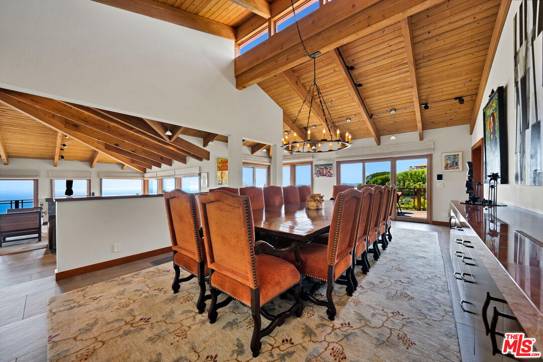 27434 Winding Way Malibu, CA 90265 - Photo 13 of 39 a dining room with furniture and a rug
