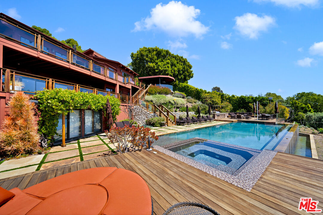 27434 Winding Way Malibu, CA 90265 - Photo 36 of 39 a view of a swimming pool with a patio