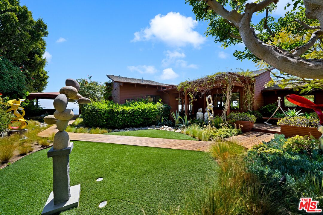 27434 Winding Way Malibu, CA 90265 - Photo 8 of 39 a view of a house with a backyard