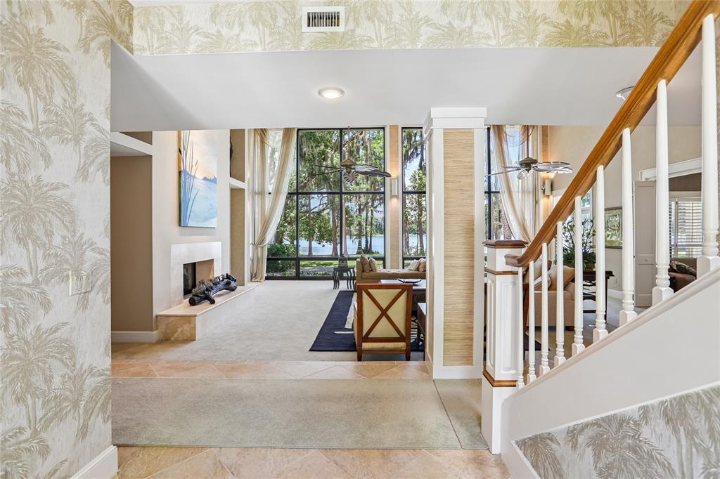 17810 Crawley Road Odessa, FL 33556 - Photo 31 of 76 a view of an entryway with floor to ceiling windows and living room
