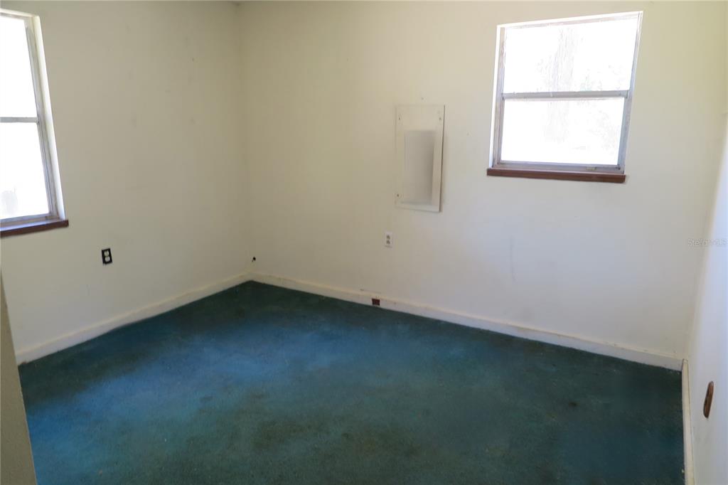 153-UNIT Ranch Road San Mateo, FL 32187 - Photo 24 of 34 an empty room with a window