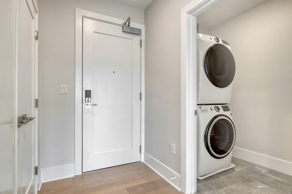 62 Foundry Street, Unit 309 Wakefield, MA 01880 - Photo 13 of 36 a view of a hallway with washer and dryer