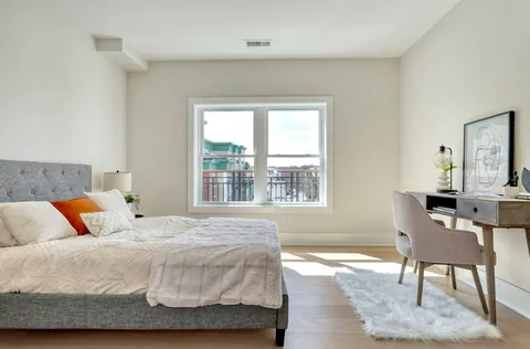 a bedroom with a bed and a table