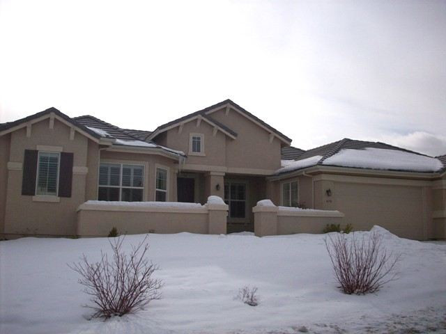 a front view of house with outdoor space