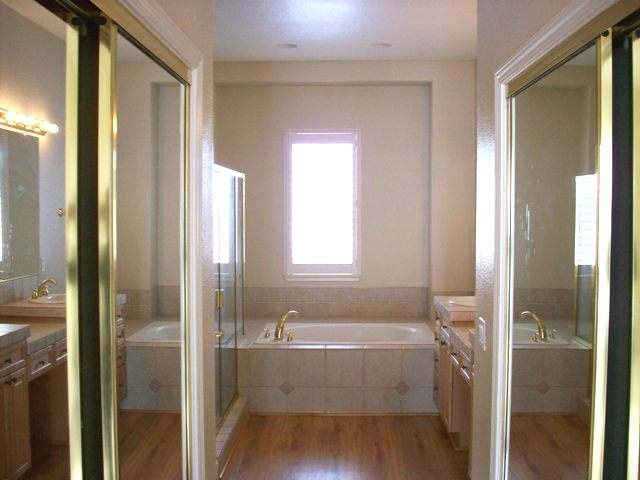 410 Octate Circle Reno, NV 89511 - Photo 6 of 8 a bathroom with a bathtub and shower