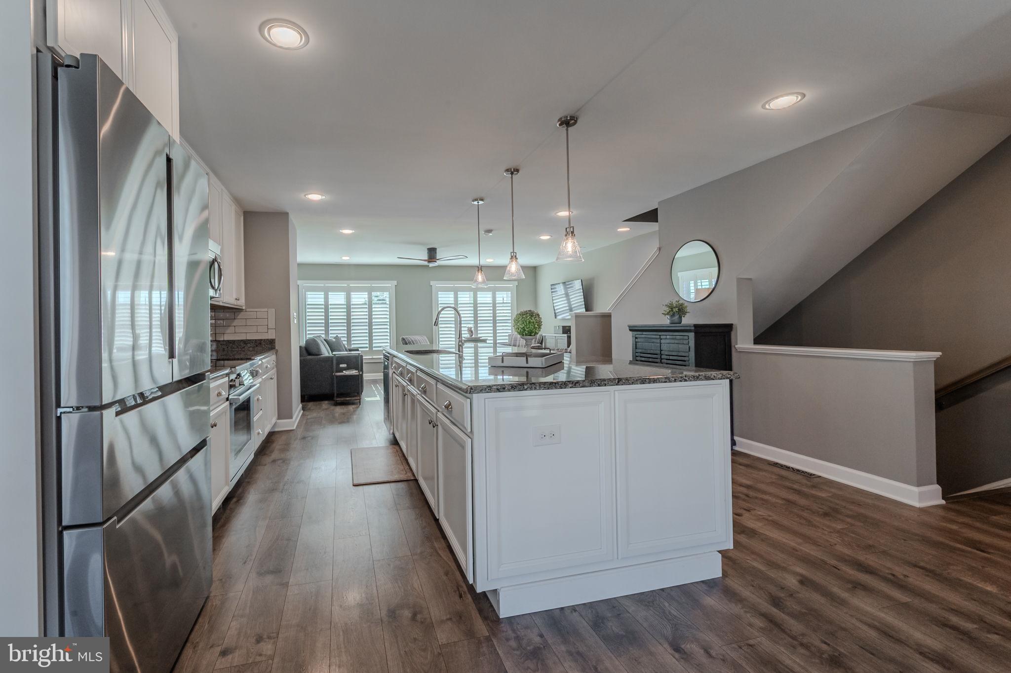 100 Anglers Road, Unit A4 Lewes, DE 19958 - Photo 19 of 57 a large white kitchen with lots of counter space