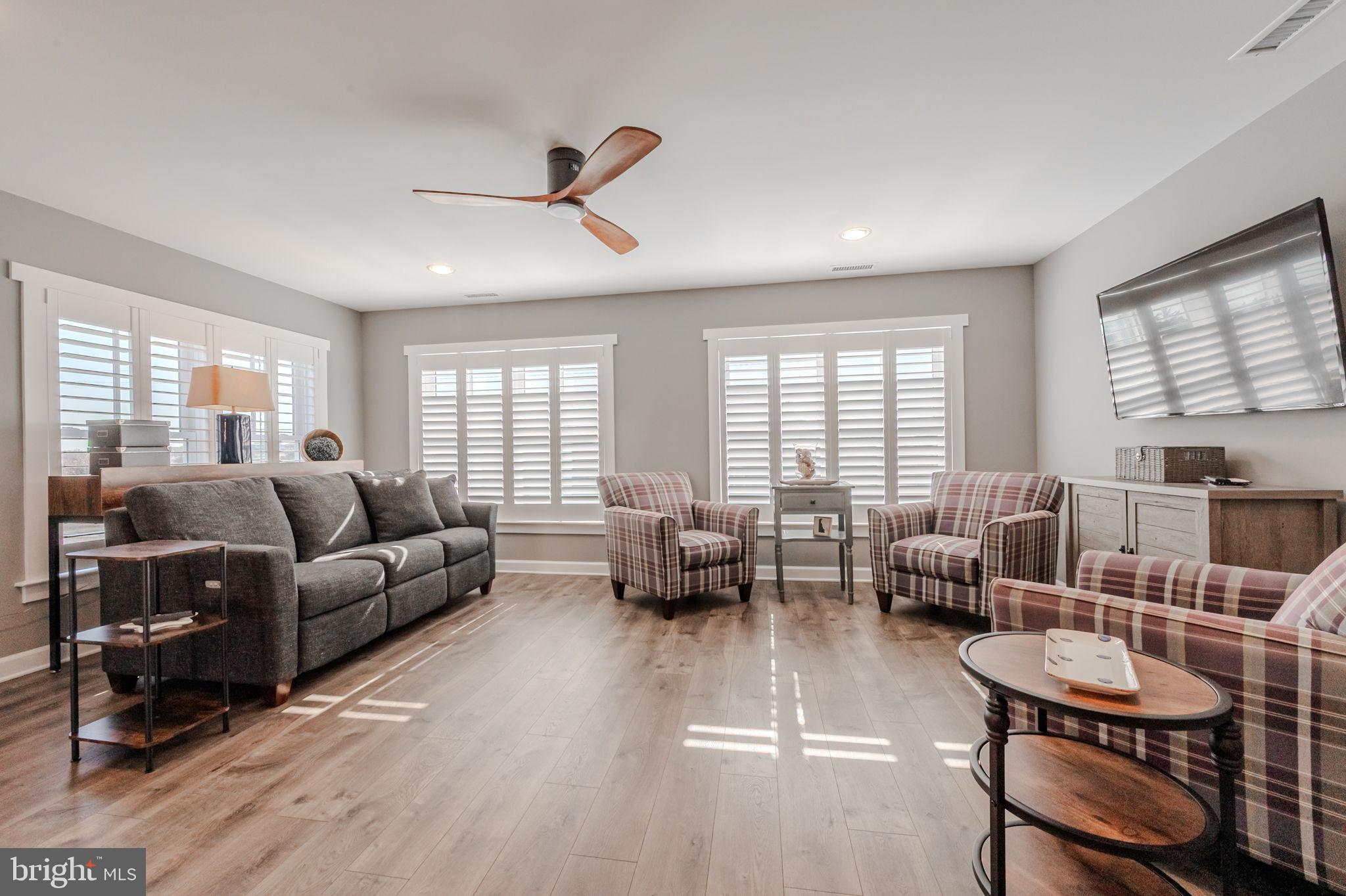 100 Anglers Road, Unit A4 Lewes, DE 19958 - Photo 27 of 57 a living room with furniture and a large window