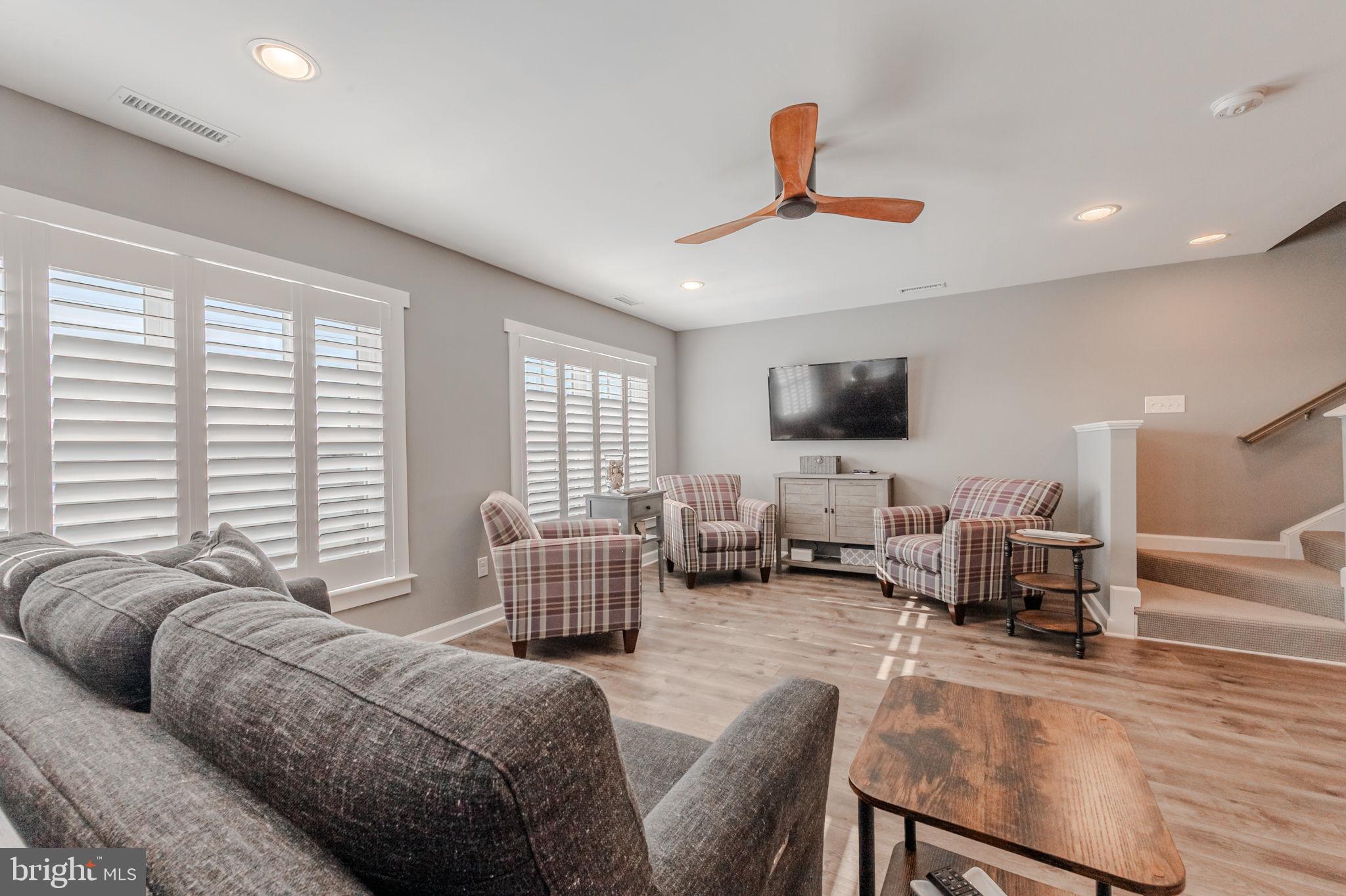 100 Anglers Road, Unit A4 Lewes, DE 19958 - Photo 29 of 57 a living room with furniture fireplace and a flat screen tv