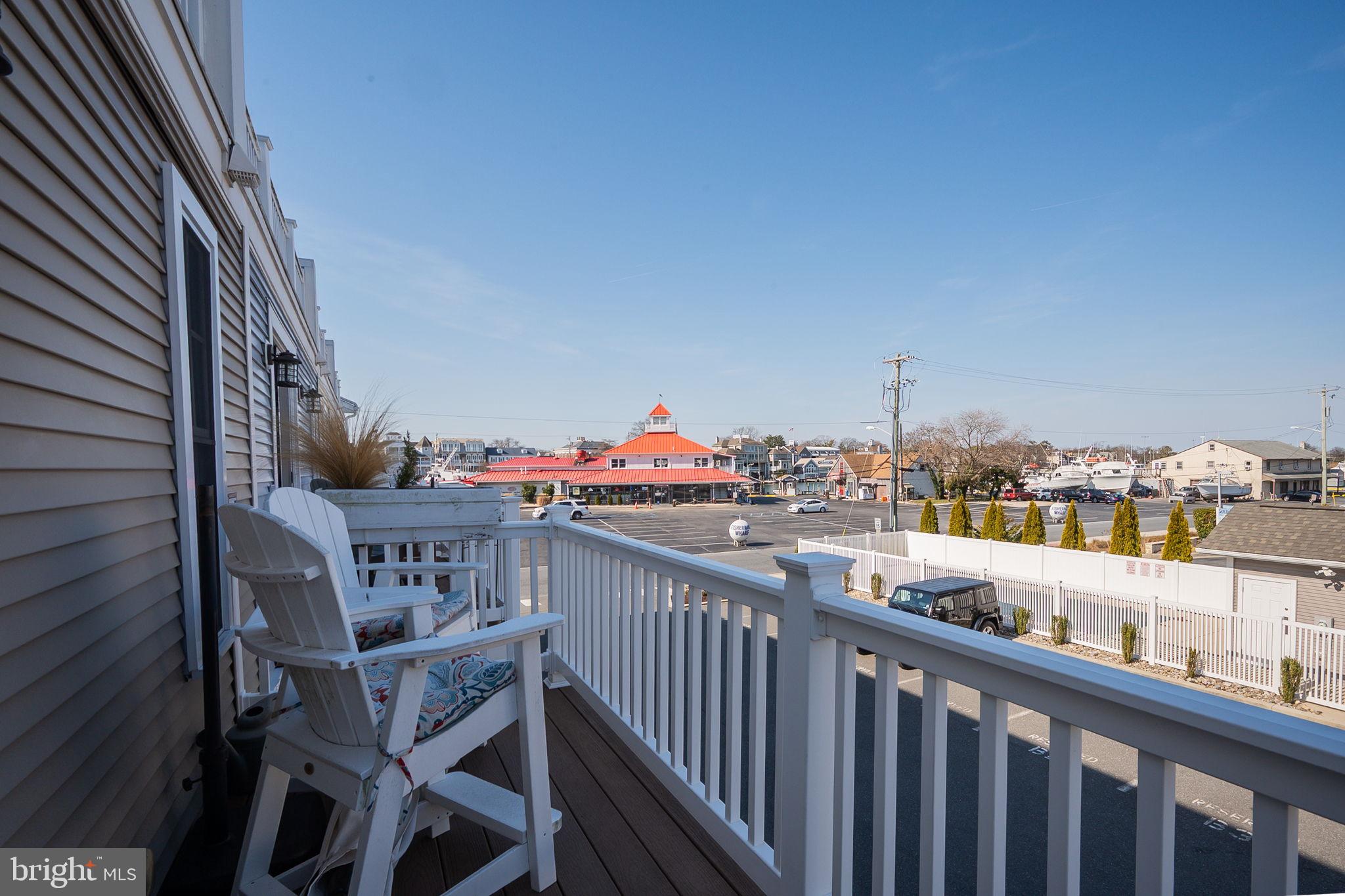 100 Anglers Road, Unit A4 Lewes, DE 19958 - Photo 30 of 57 a view of roof deck with two chairs and wooden floor