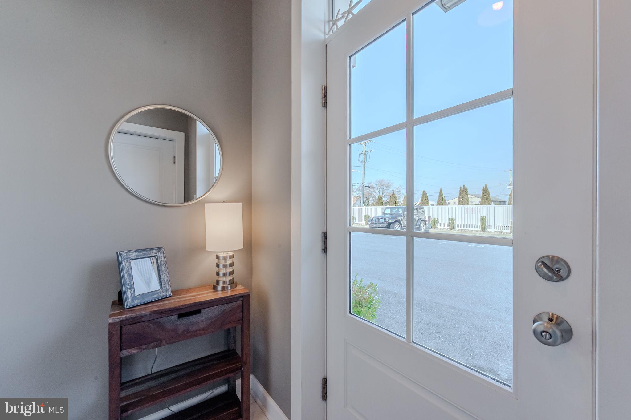 100 Anglers Road, Unit A4 Lewes, DE 19958 - Photo 3 of 57 a bathroom with a mirror and vanity