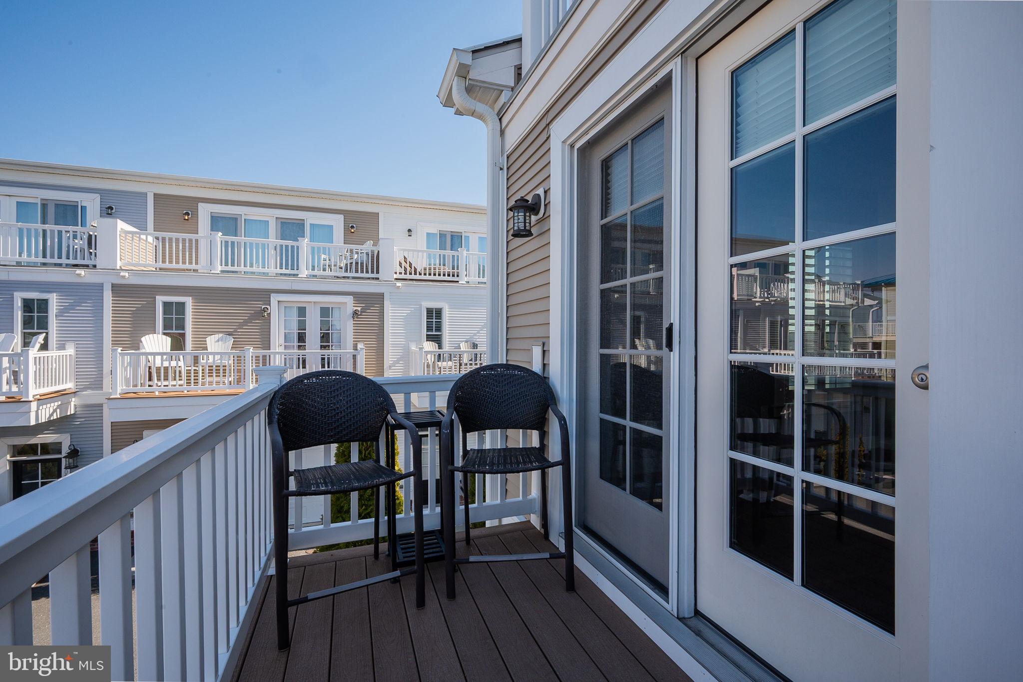 100 Anglers Road, Unit A4 Lewes, DE 19958 - Photo 31 of 57 a view of balcony with furniture and wooden floor