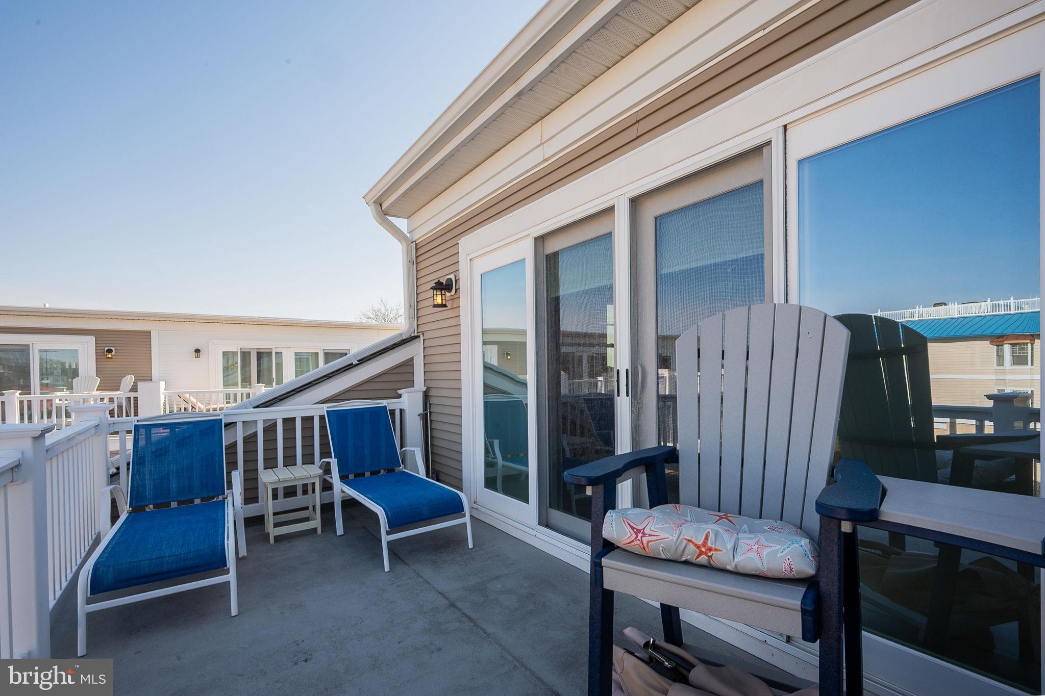 100 Anglers Road, Unit A4 Lewes, DE 19958 - Photo 46 of 57 a balcony with furniture and outdoor space