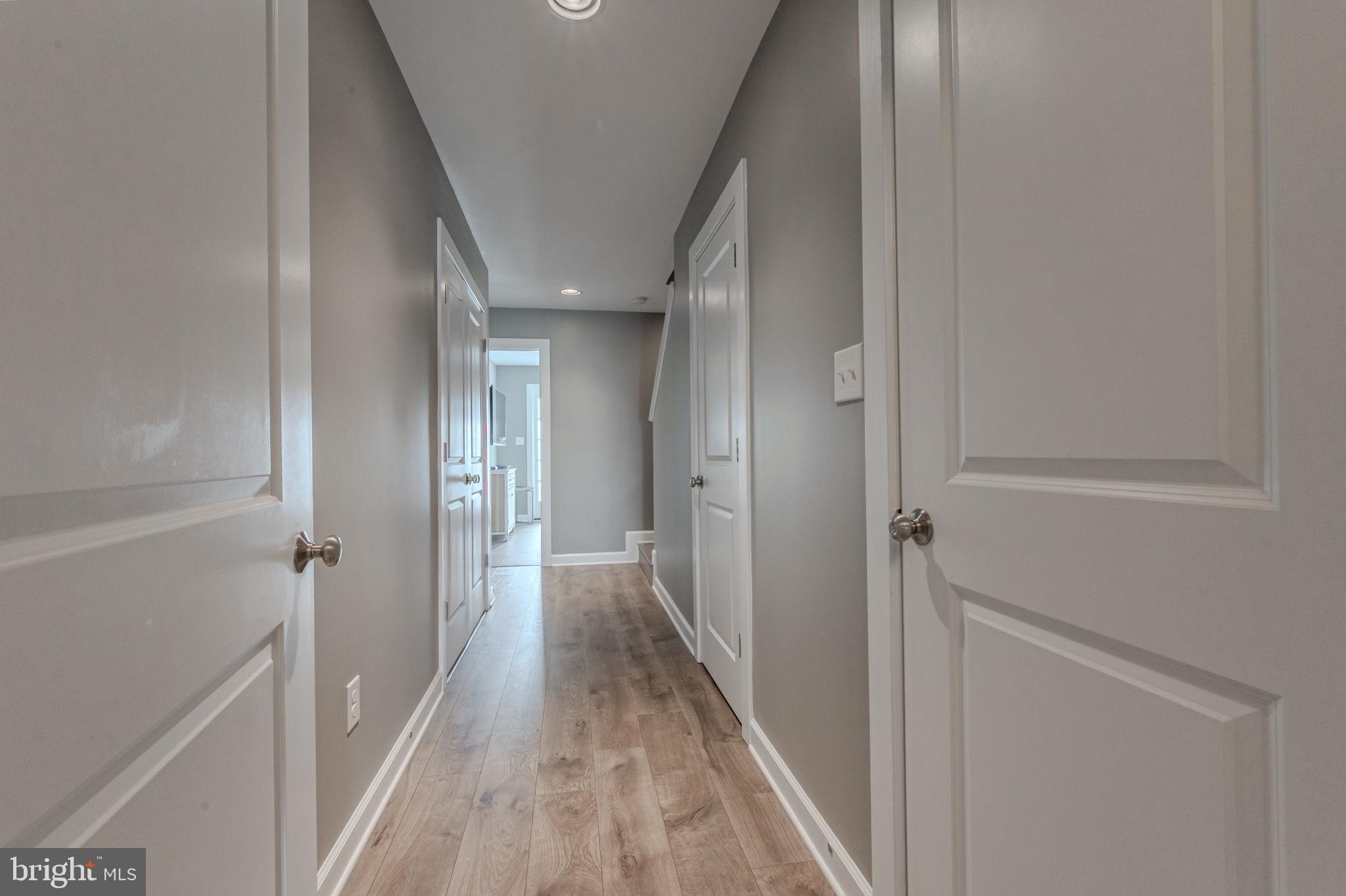 100 Anglers Road, Unit A4 Lewes, DE 19958 - Photo 5 of 57 a view of a hallway with wooden floor