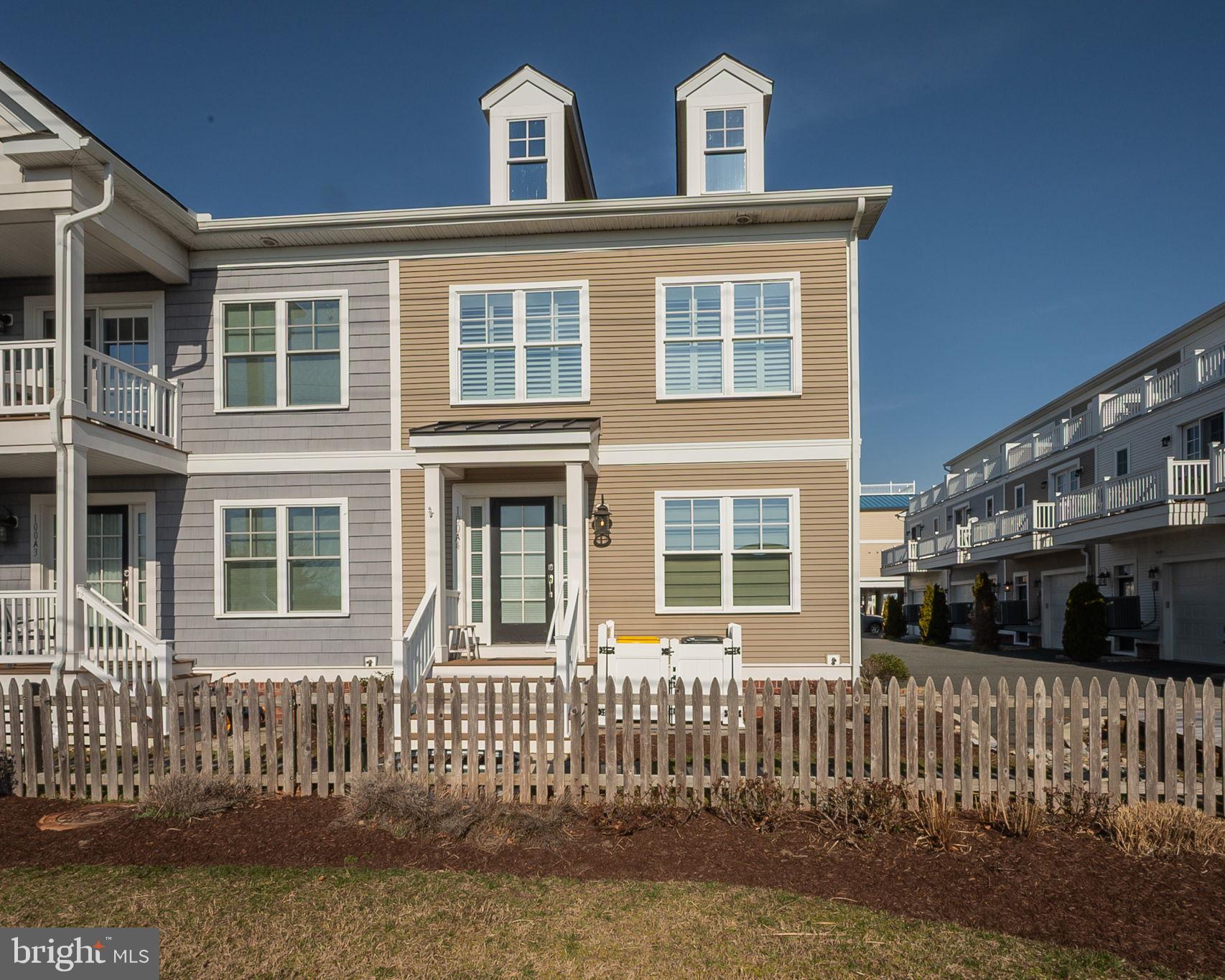 100 Anglers Road, Unit A4 Lewes, DE 19958 - Photo 56 of 57 a front view of a house with a yard