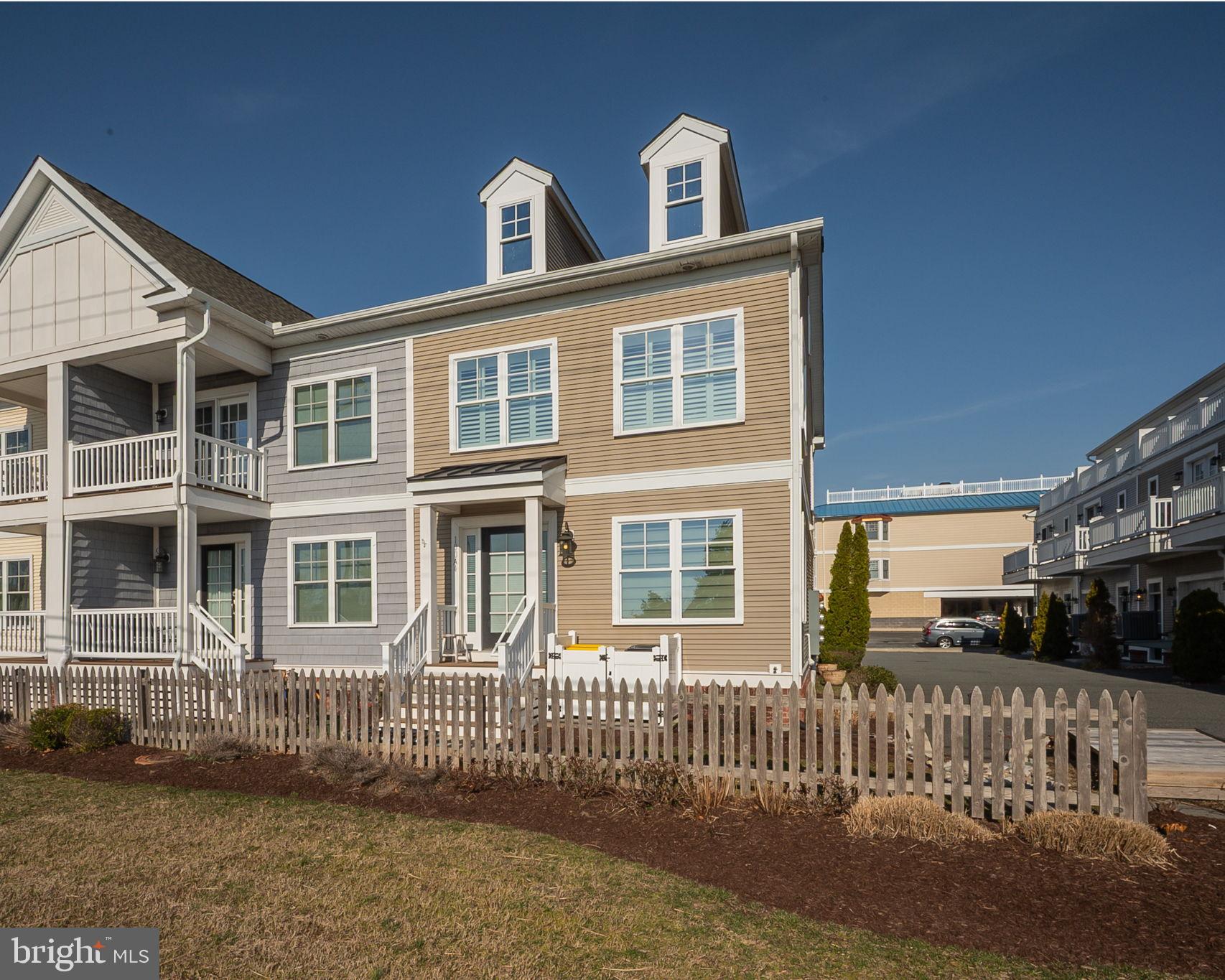 100 Anglers Road, Unit A4 Lewes, DE 19958 - Photo 57 of 57 a front view of a house with a yard