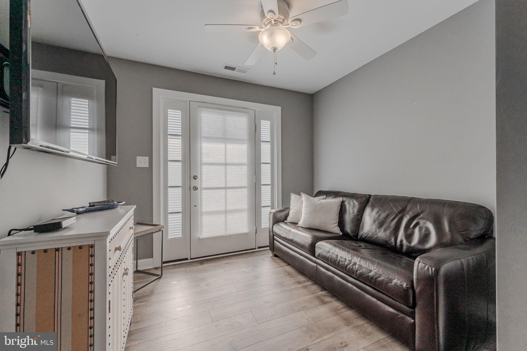 100 Anglers Road, Unit A4 Lewes, DE 19958 - Photo 10 of 57 a living room with furniture and a flat screen tv