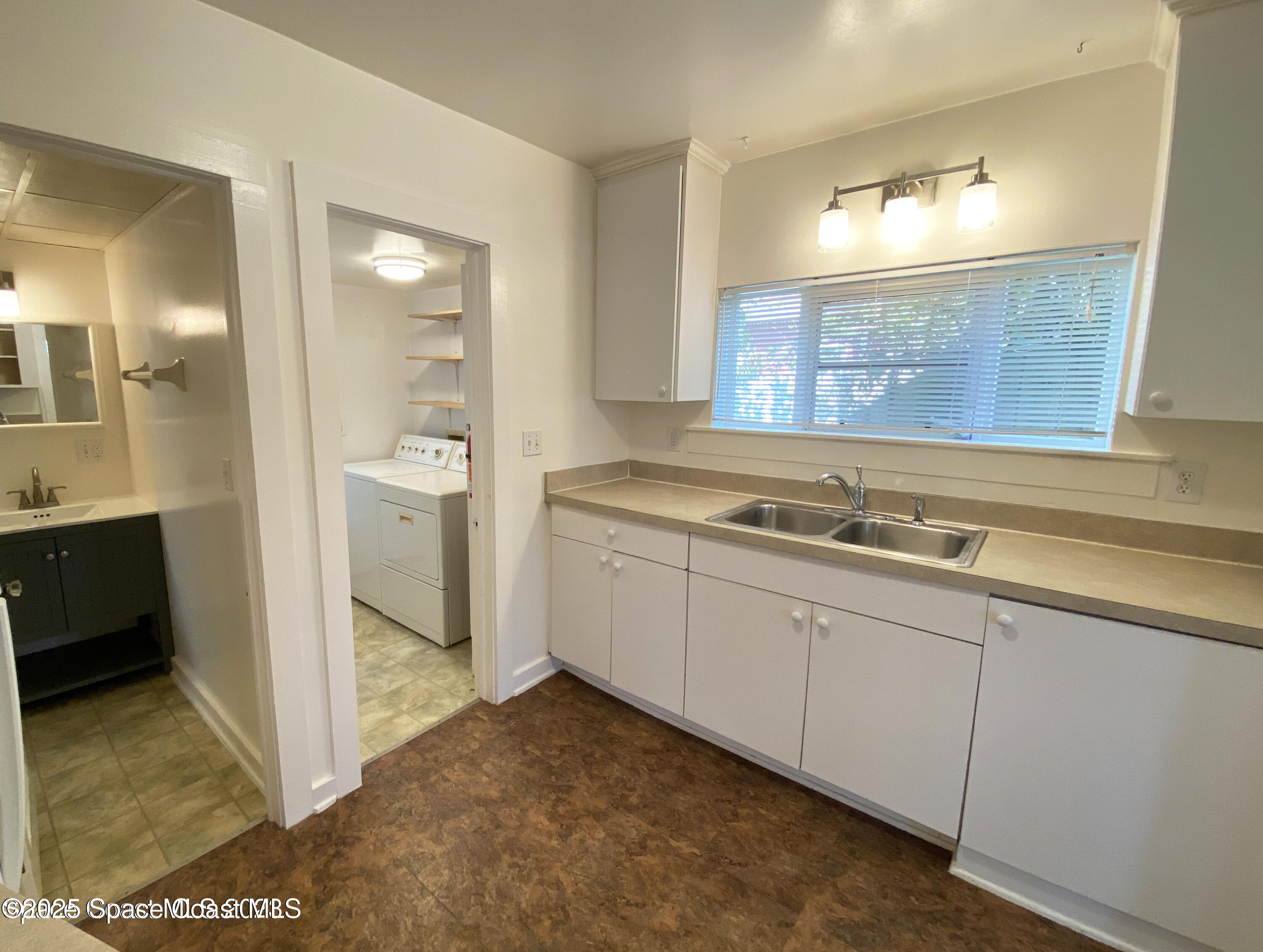 15 Parkway Street, Unit A Cocoa, FL 32922 - Photo 22 of 25 a view of a bathroom with a sink and a mirror