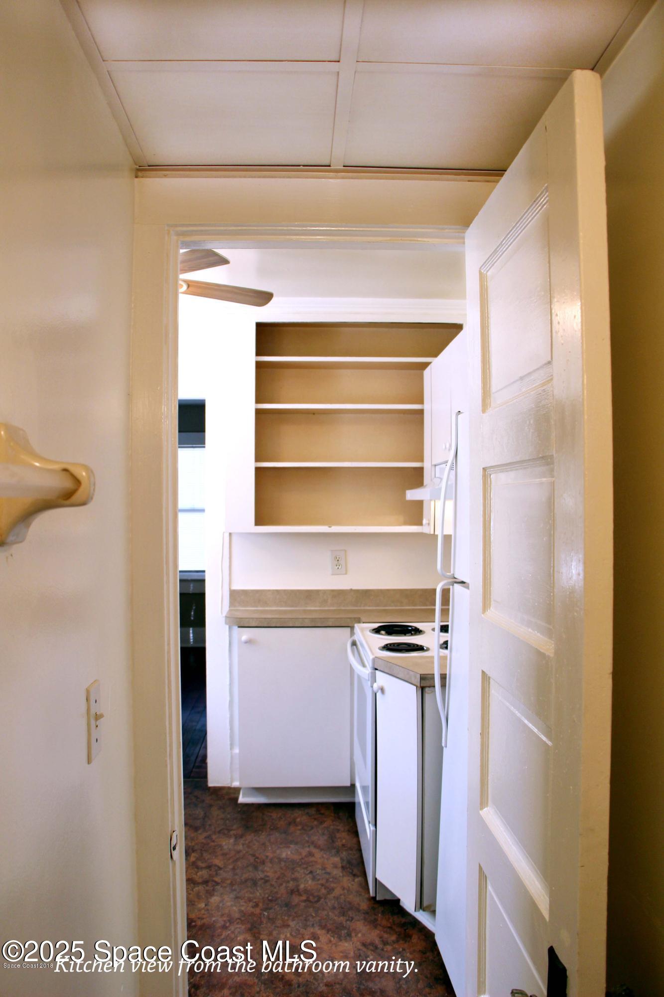 15 Parkway Street, Unit A Cocoa, FL 32922 - Photo 7 of 25 a view of walk in closet with empty racks