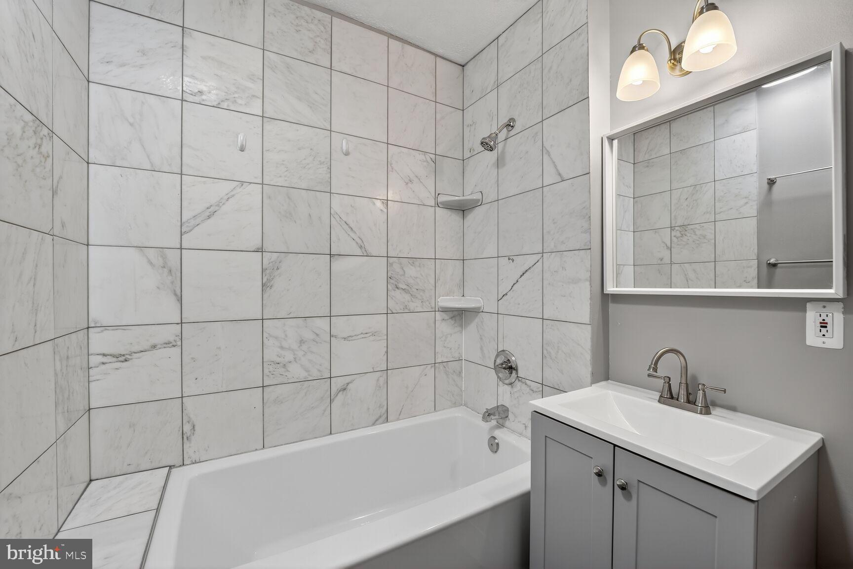 3700 13th Street Northwest Washington, DC 20010 - Photo 15 of 35 a bathroom with a sink a toilet and shower