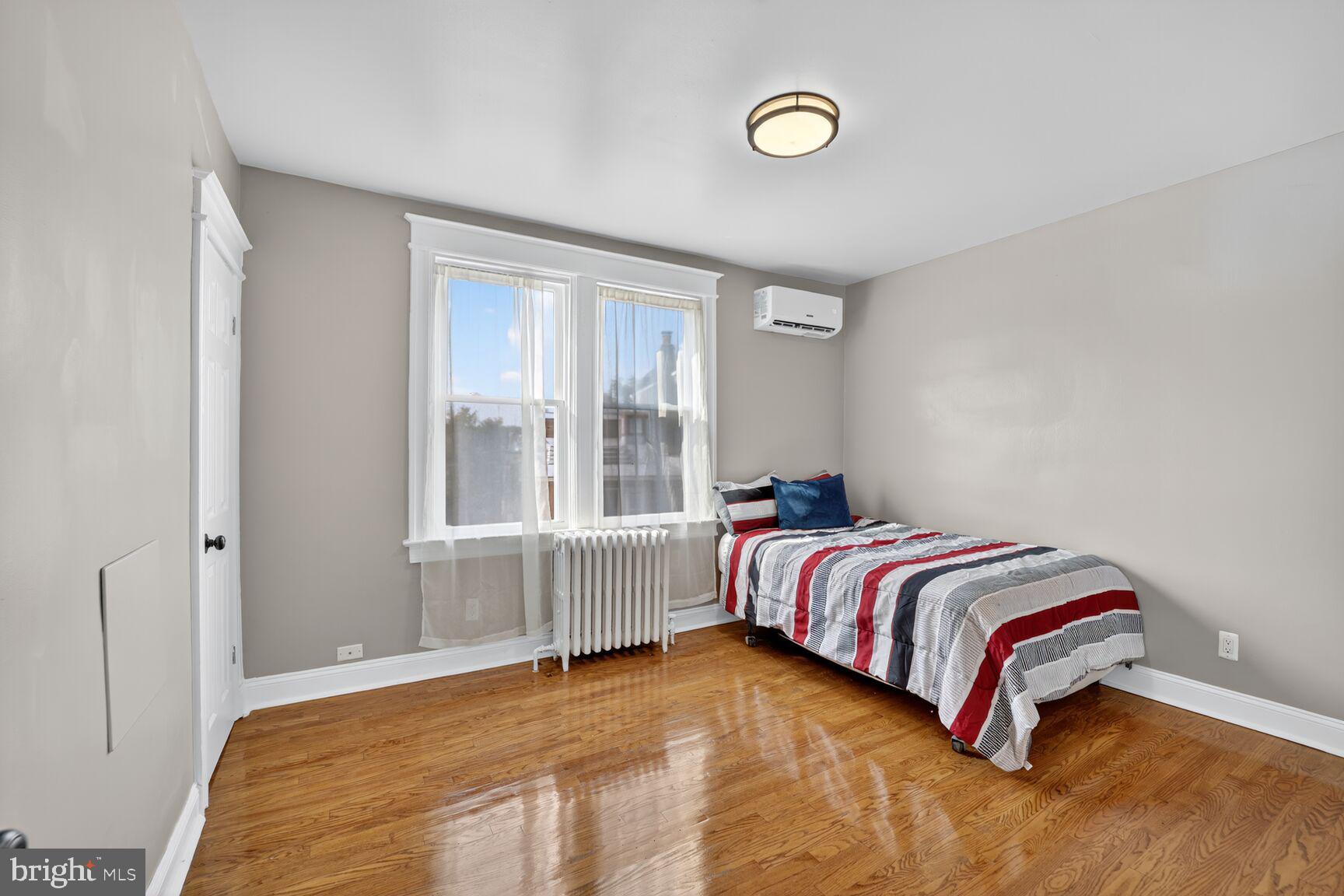 3700 13th Street Northwest Washington, DC 20010 - Photo 18 of 35 a bedroom with a bed and a window
