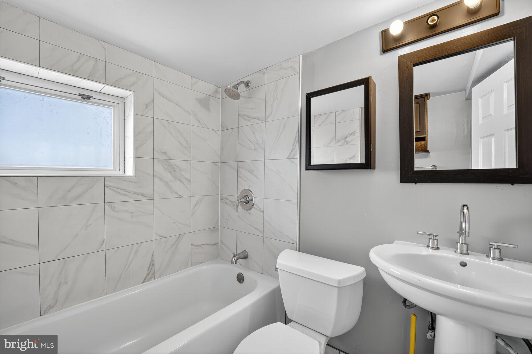 3700 13th Street Northwest Washington, DC 20010 - Photo 23 of 35 a bathroom with a toilet sink and bathtub