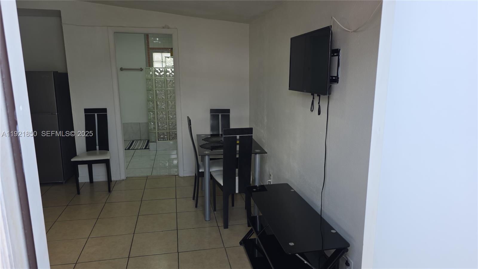 30232 Southwest 172nd Avenue Homestead, FL 33030 - Photo 14 of 31 a view of a hallway with workspace and living room area
