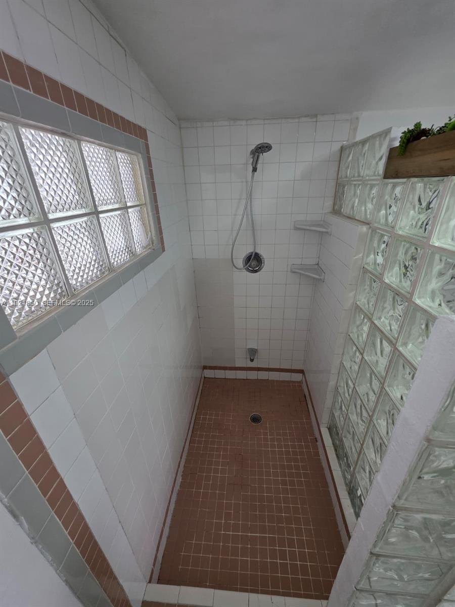 30232 Southwest 172nd Avenue Homestead, FL 33030 - Photo 17 of 31 a view of water heater room with a fireplace