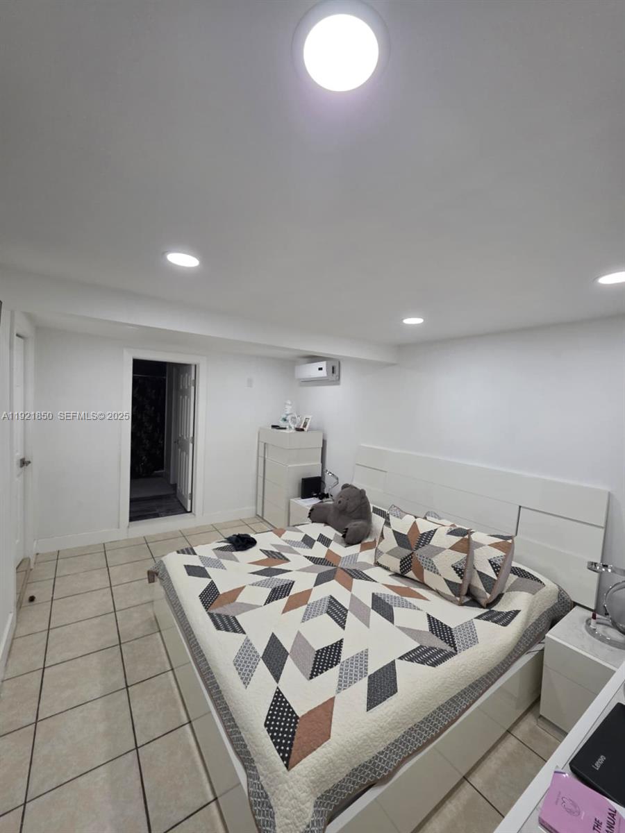 30232 Southwest 172nd Avenue Homestead, FL 33030 - Photo 21 of 31 a living room with a bed and a coffee table