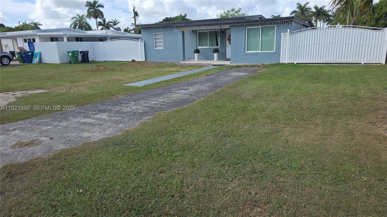 30232 Southwest 172nd Avenue Homestead, FL 33030 - Photo 3 of 31 a front view of house with yard and seating area