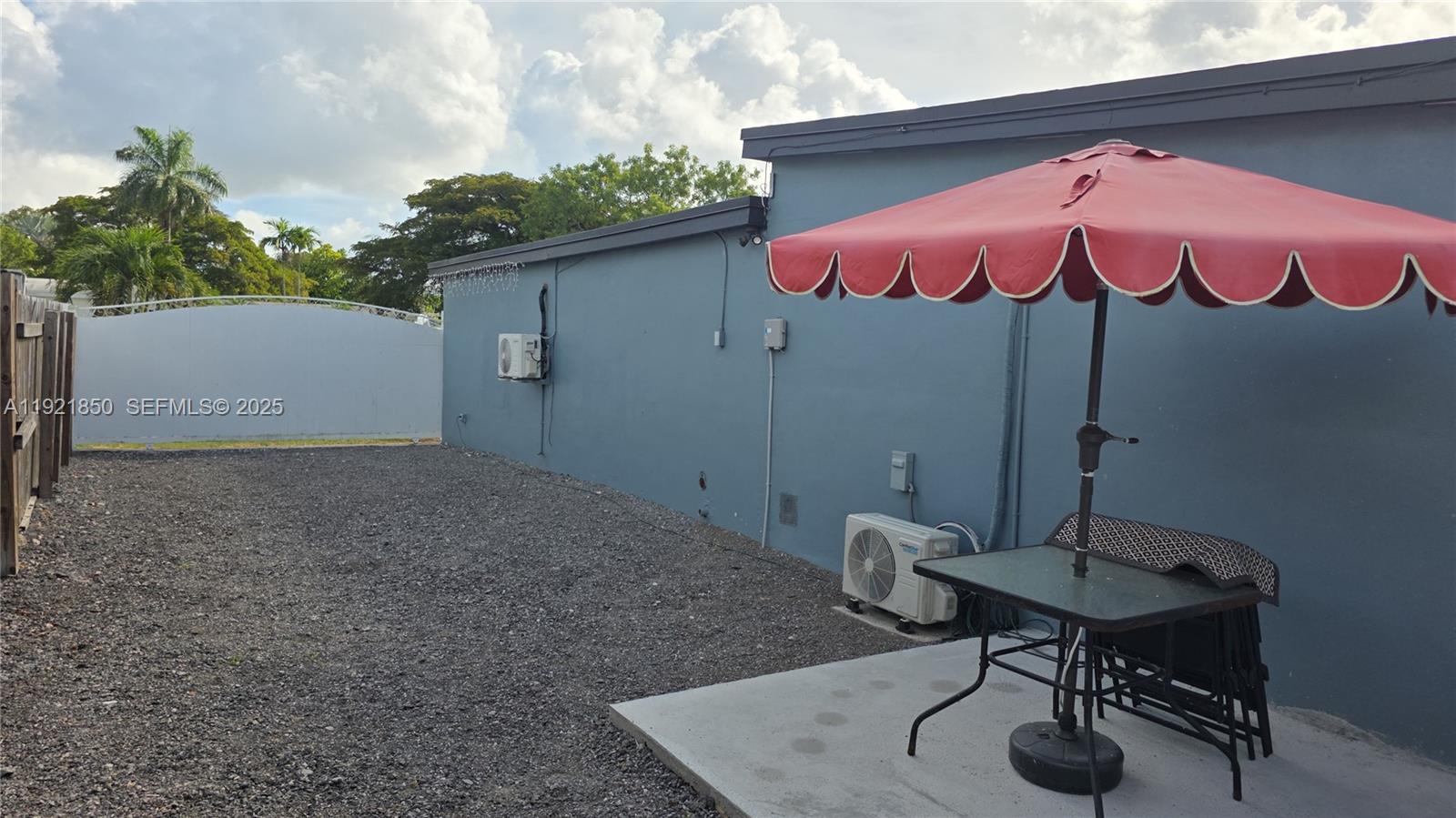 30232 Southwest 172nd Avenue Homestead, FL 33030 - Photo 8 of 31 a backyard of a house with table and chairs