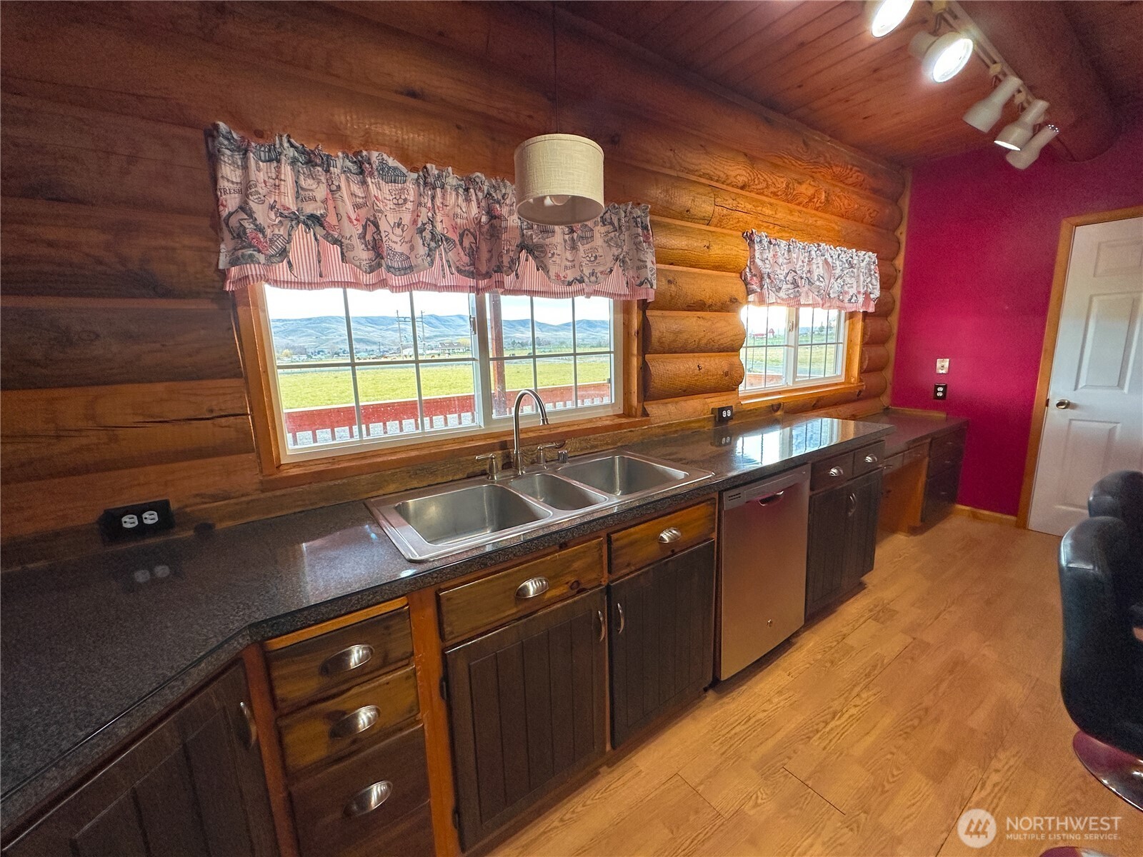 161802 West Buena Vista Road Prosser, WA 99350 - Photo 12 of 40 a kitchen with granite countertop a sink stove and cabinets