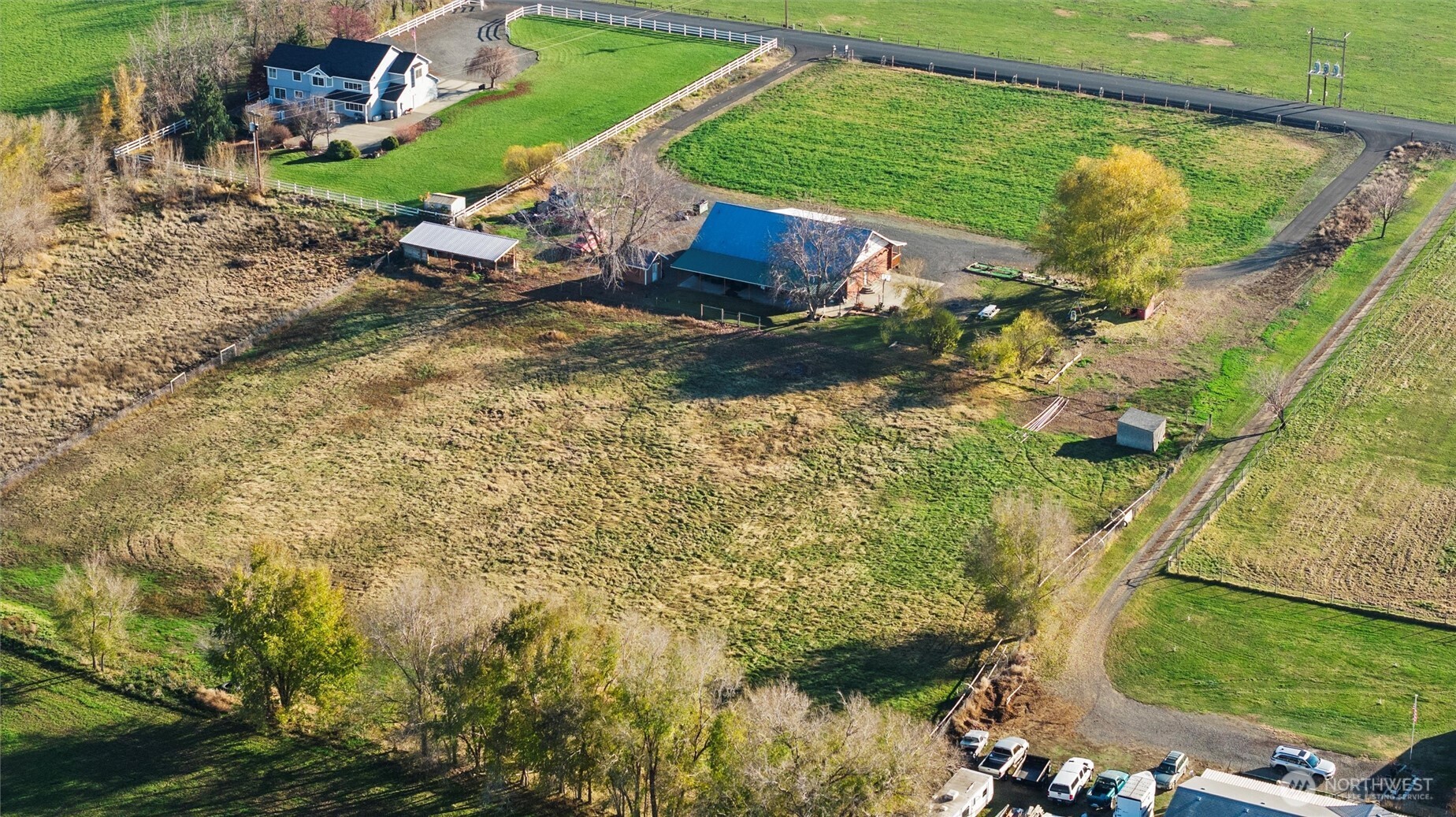 161802 West Buena Vista Road Prosser, WA 99350 - Photo 20 of 21 an aerial view of a house with a yard and lake view