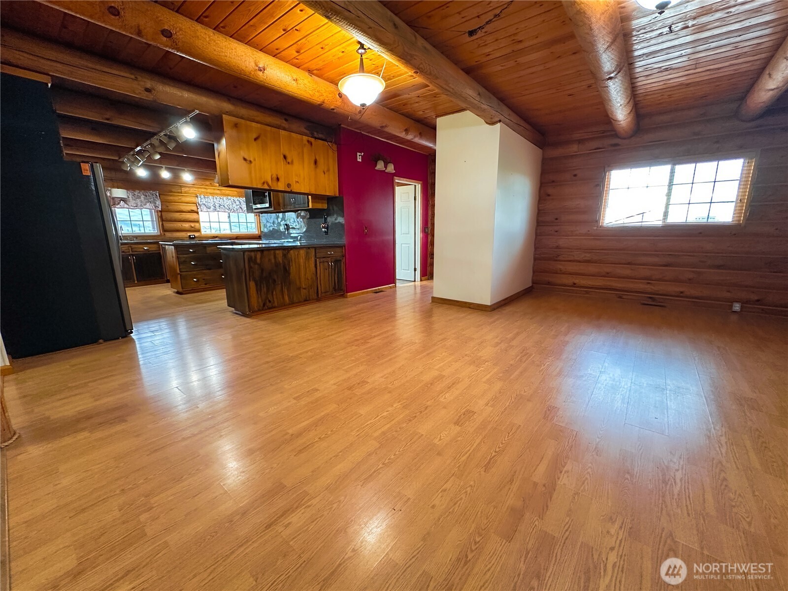 161802 West Buena Vista Road Prosser, WA 99350 - Photo 9 of 40 a view of a living room with kitchen and wooden floors