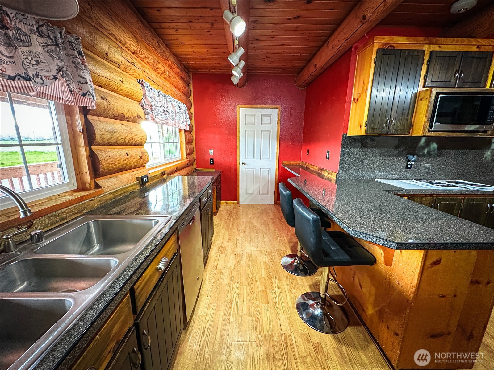 161802 West Buena Vista Road Prosser, WA 99350 - Photo 10 of 40 a view of a kitchen with a sink and wooden floor