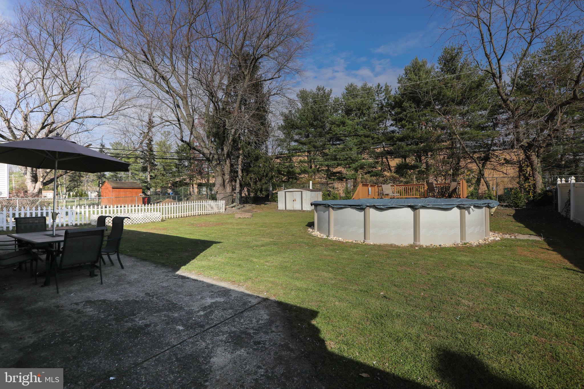 685 Cypress Road Warminster, PA 18974 - Photo 38 of 41 Nice fenced yard with a patio and pool with deck!